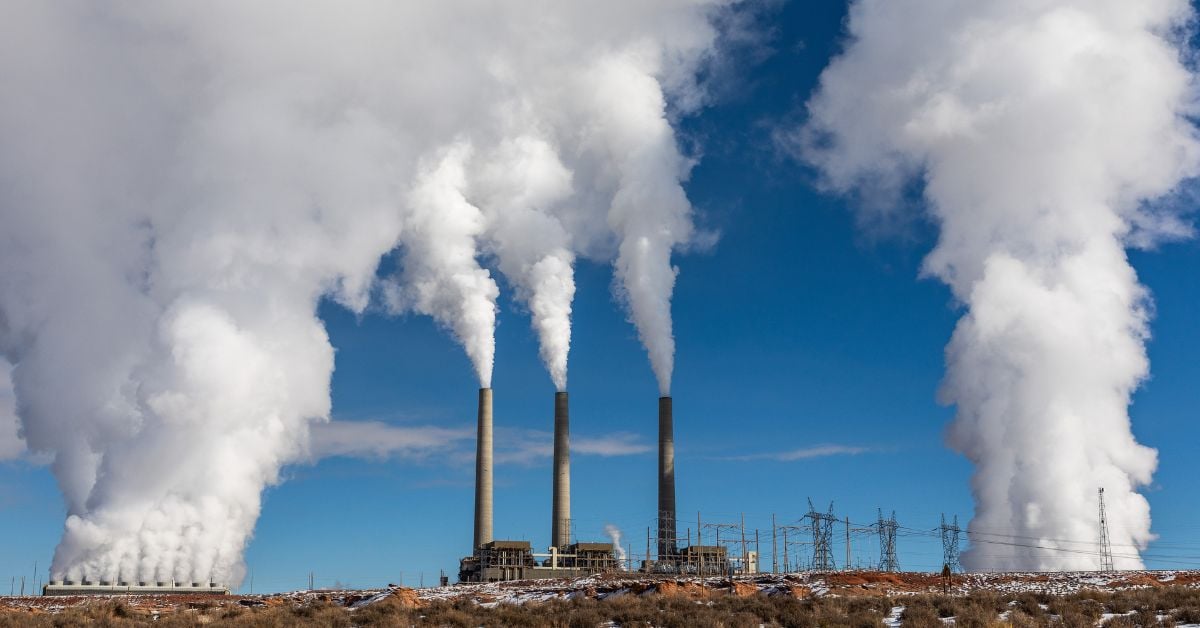 Smoke billowing out of factory chimneys